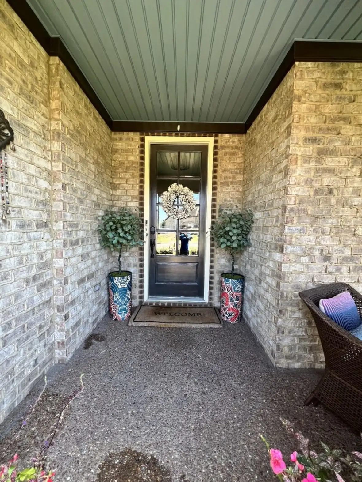 Porch with a freshly painted blue ceiling and brick exterior, Hendersonville TN