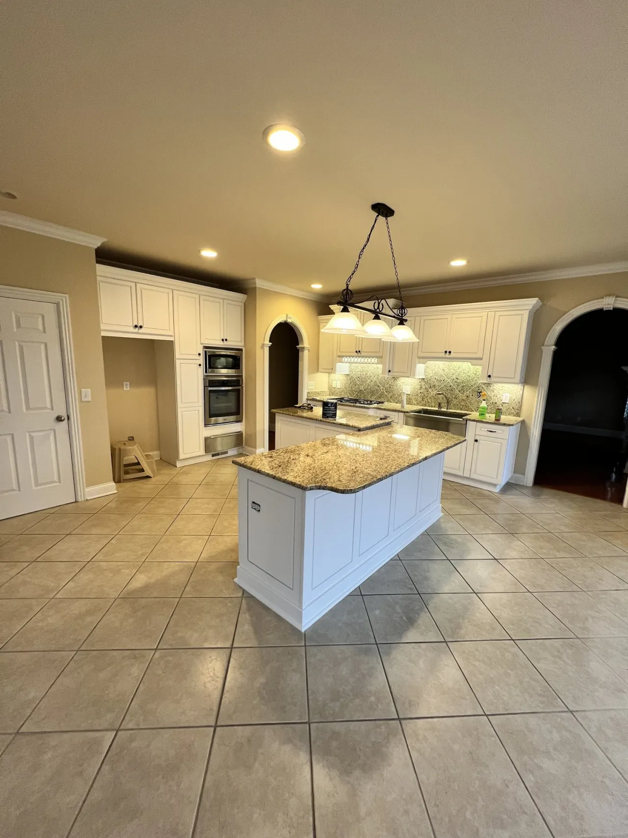 Freshly painted kitchen cabinets — cabinet refinishing by Drop Zone Painting