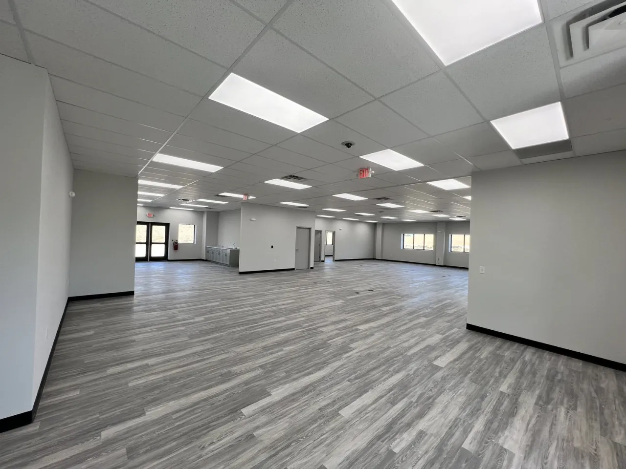 Painters working in a modern commercial office space